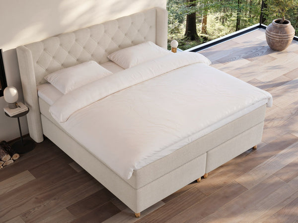 Eira Fjord 220x220 Bouclé cream Nordic Dream tilbyder senge med skandinavisk design og højkvalitets materialer. Oplev perfekt komfort for en god nattesøvn. Bestil din i dag!