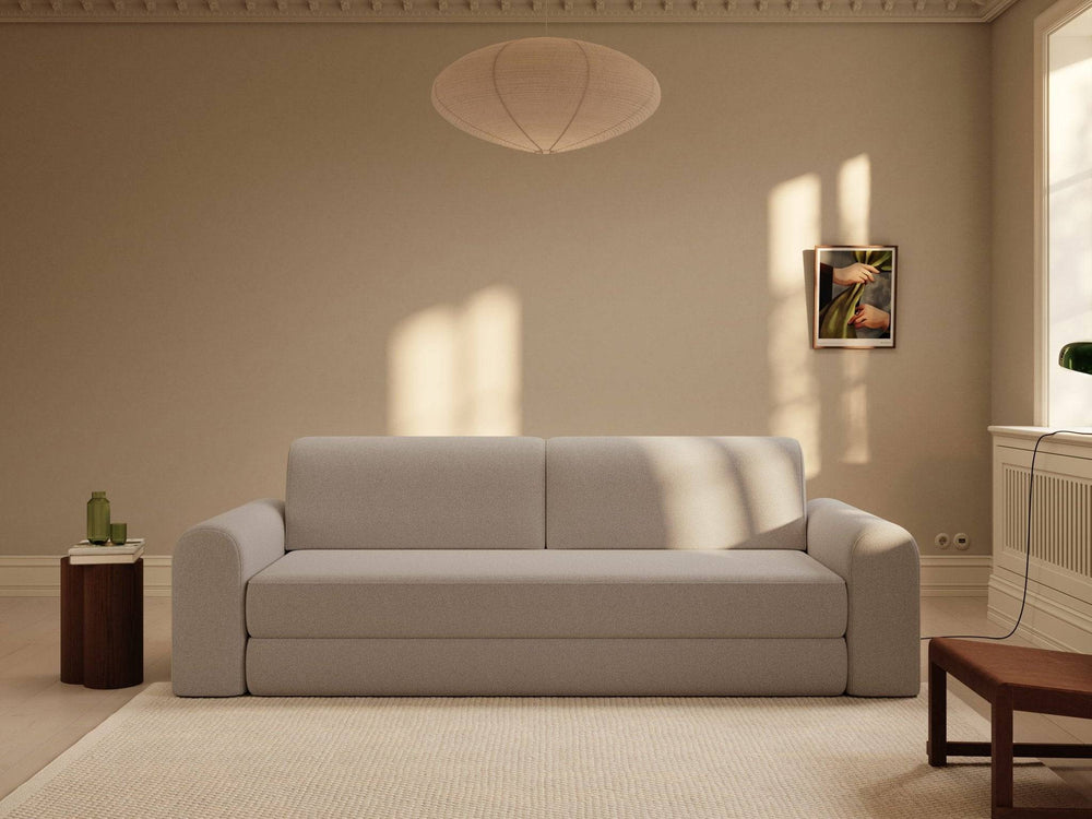 Astra sovesofa 200x200 cm i beige bouclé, bløde afrundede armlæn og lav ryglæn i minimalistisk stueopsætning