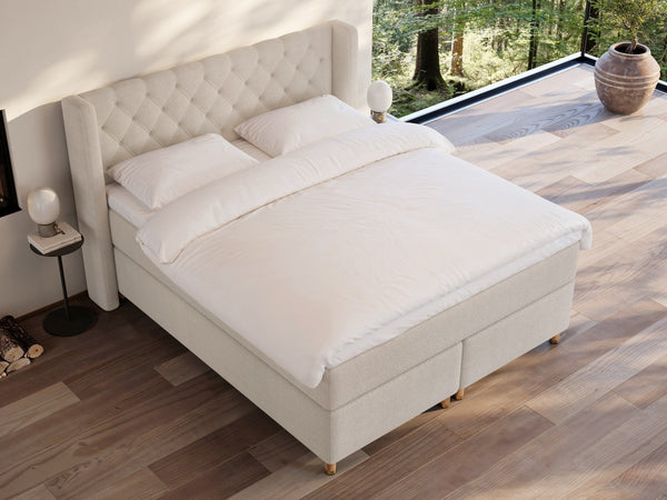 Eira Fjord 180x200 Bouclé cream Nordic Dream tilbyder senge med skandinavisk design og højkvalitets materialer. Oplev perfekt komfort for en god nattesøvn. Bestil din i dag!
