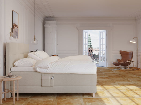 Aura Fjord 210x210 Bouclé cream Nordic Dream tilbyder senge med skandinavisk design og højkvalitets materialer. Oplev perfekt komfort for en god nattesøvn. Bestil din i dag!