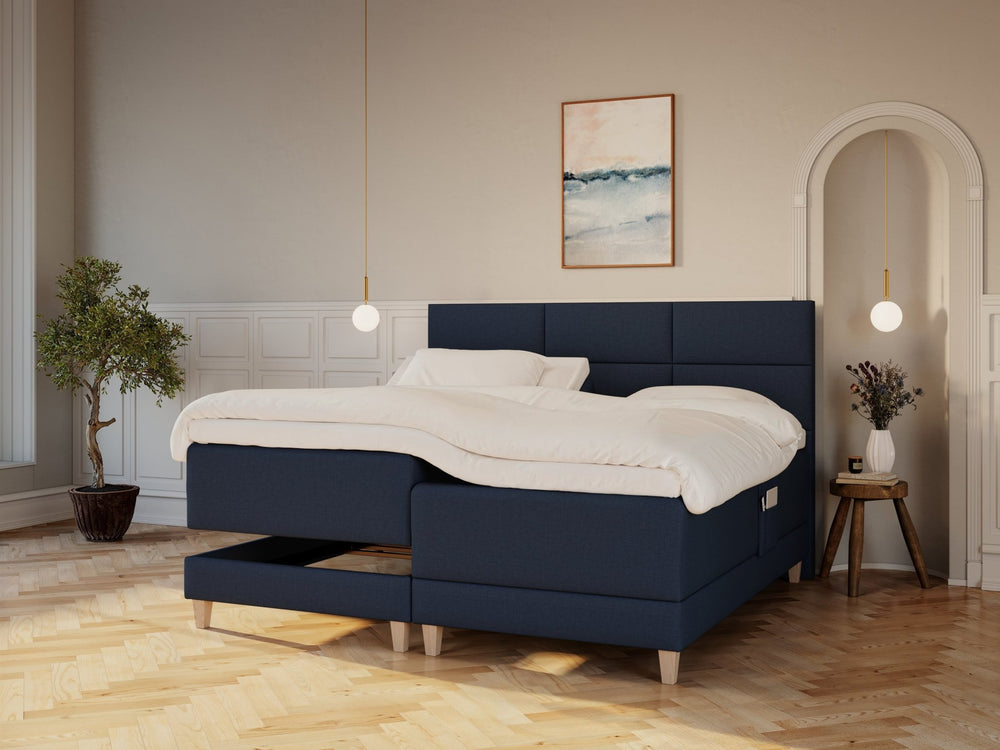 Aura Nordlys 210x210 Dyb blå Nordic Dream tilbyder senge med skandinavisk design og højkvalitets materialer. Oplev perfekt komfort for en god nattesøvn. Bestil din i dag!