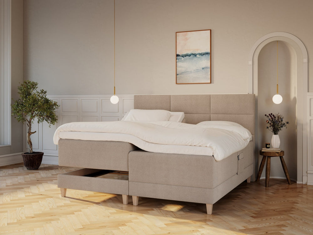 Aura Älv 210x210 Bouclé latte Nordic Dream tilbyder senge med skandinavisk design og højkvalitets materialer. Oplev perfekt komfort for en god nattesøvn. Bestil din i dag!